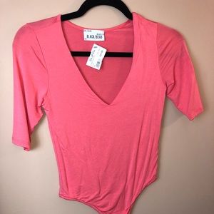 Brand new peach body suit with tags!